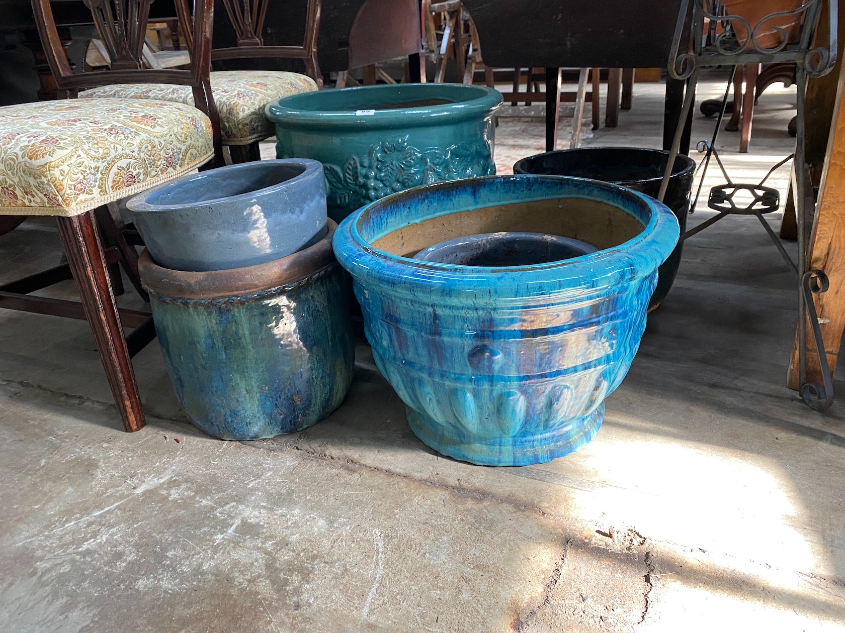 Six assorted circular glazed earthenware garden planters, largest diameter 47cm, height 47cm